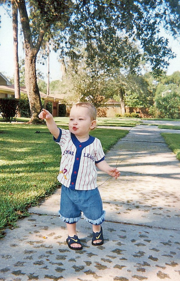 Toddler Sam on sidewalk
